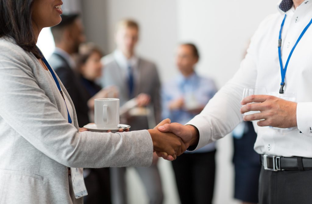 handshake of people at business conference